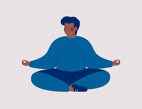 Black man sits with cross-legged on the floor and meditates with closed eyes. African American male makes morning yoga, relaxes at home or breathing exercises.