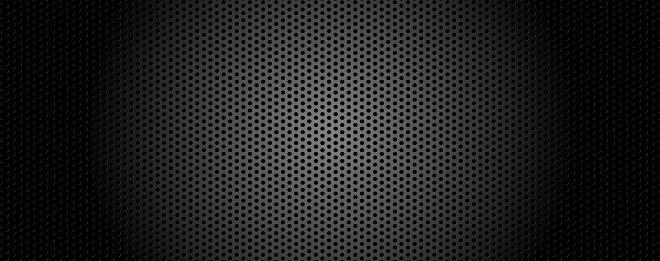 Black metal with lighting, texture steel abstract and background. Perforated sheet metal, engineering material concept