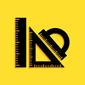 Black Set ruler, triangular ruler and protractor icon isolated on yellow background. Straightedge sign. Triangle sign. Geometrical instruments. Long shadow style. Vector.