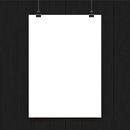 Blank poster on black wooden wall