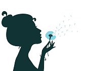 Silhouette of a young girl blowing dandelion isolated in white. Vector illustration