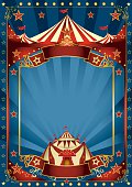 A blue background circus with a large copy space and a big top for your message.