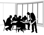Business people working around a small table in the office
