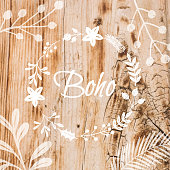 Boho Frame Background with White Flower Wreath Stencil On Shabby Wood Wall. Shabby Wooden Background. Grunge Texture, Painted Surface. Coastal Background.