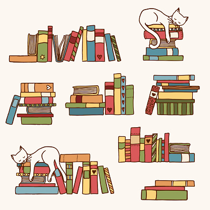 Book stacks with cute sleeping cat