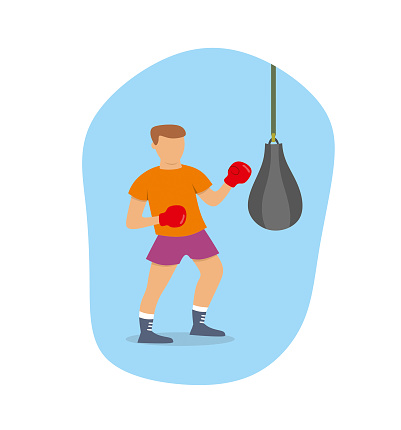 Boxer is training with  a punching bag