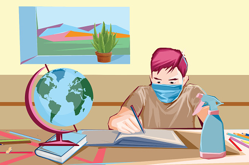 Boy at school wearing face mask and learning geography