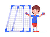 Boy goalkeeper stands next to the football goal in gloves. Child soccer player stands at the gate. Vector illustration isolated on white, flat style.