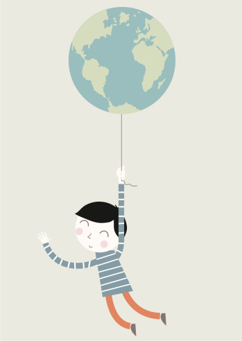 Boy holding earth balloon