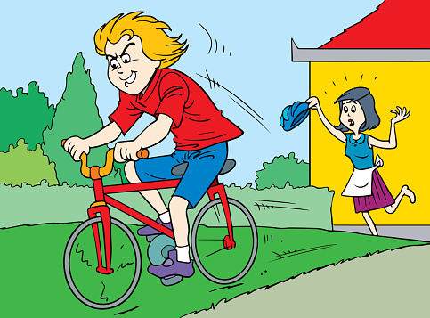 A boy without a helmet is riding a bike.