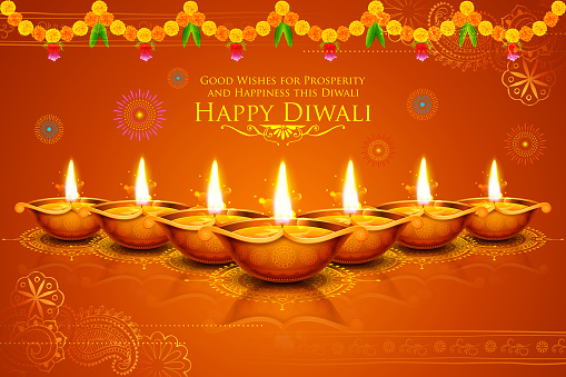 Burning diya on Happy Diwali Holiday background for light festival