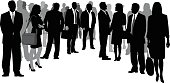 A vector silhouette illustration of business men and woman standing in a crowd together in a curve.  Men wear suits while women wearing office dress and carry bags.