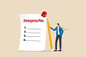 istock Business emergency plan, checklist to do when disaster happen to continue business and build resilience concept, smart businessman leader holding pencil with paper of emergency plan flashing siren. 1300772467