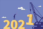 istock Business man directs crane installation 2021 1288125306