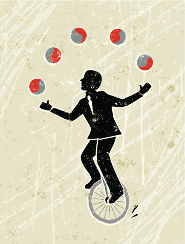 Business Man Juggling Balls Whilst Riding a Unicycle