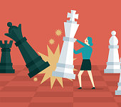 Business plan and strategy concept - Businesswoman moving giant chess piece against another chess piece.