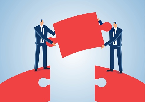 Business project cooperation and merger, two businessmen jigsaw puzzle connecting bridge, partnership and teamwork, concept of business and corporate culture