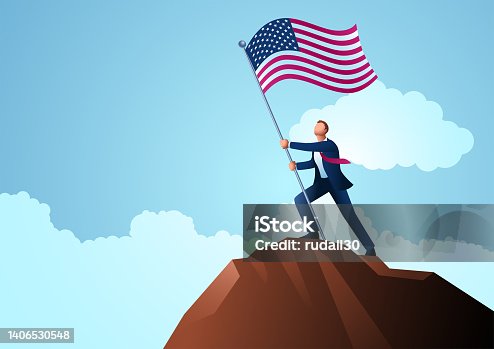 istock Businessman on top of the mountain holding the flag of USA 1406530548