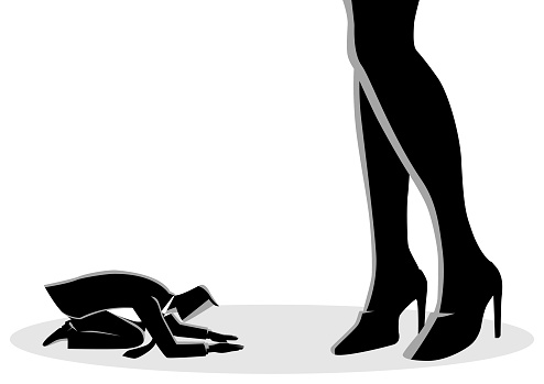 Businessman prostrated under female high heels