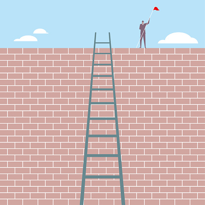 A businessman standing on the wall,a ladder is on the wall.