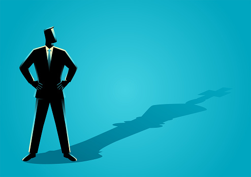 Business concept vector illustration of a businessman standing with the shadow of a chess king vector