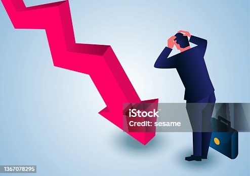 istock BusinessmanBusinessman holding his head in his hands and looking desperately at the falling arrow holding his head in his hands and looking desperately at the falling arrow 1367078295