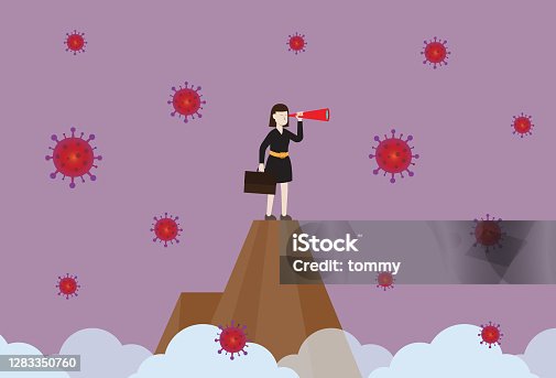 istock Businesswoman holds a binoculars stand on a top of a mountain with a virus 1283350760