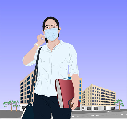 Businesswoman with protective face mask and file in city