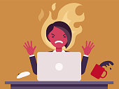 istock Businesswoman working with laptop flamed in anger 1344281275