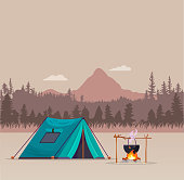istock Camping in the mountains. Camping with a tent, a Mount and a bonfire against the backdrop of a mountain landscape. Vector, cartoon illustration. 1329517125