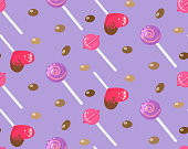 istock Candy seamless pattern hearts, lollipop and dragee 1348278680