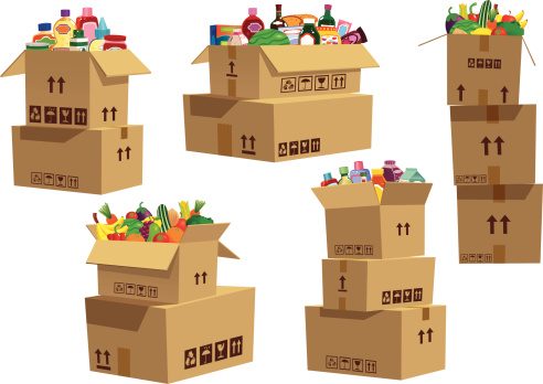 Cardboard boxes stacked with grocery goods