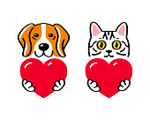 istock Cat and dog holding a heart 1326139274