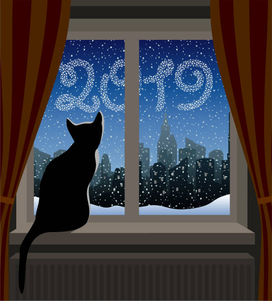 Cat Looking at Winter City. New Year 2019 Cat Looking at Winter City. New Year 2019 window silhouettes stock illustrations