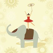 Little child performing an equilibrium show over an elephant.