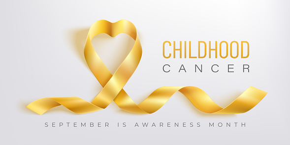 Childhood cancer awareness gold ribbon on baby hand on a white background. Gold ribbon symbolic concept raising campaign support help childhood cancer awareness