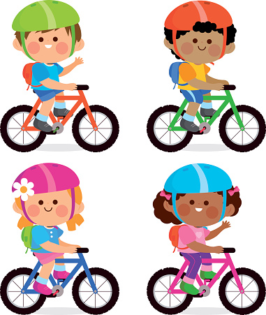 Children riding bicycles and wearing their helmets and backpacks.