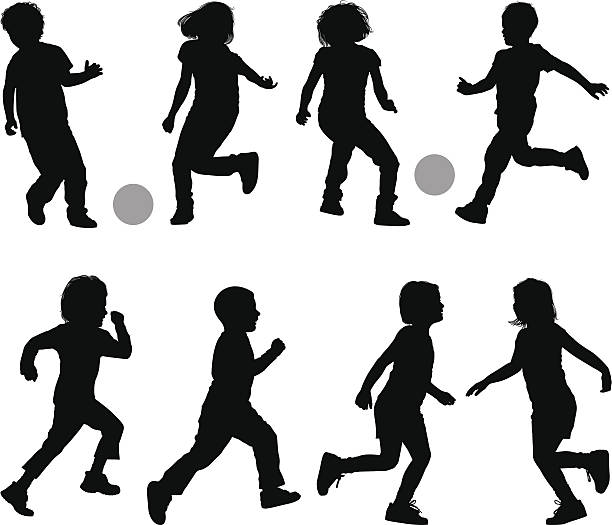 Children Children playing soccer silhouettes stock illustrations