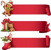 illustration of gingerbread man, christmas stocking and gift with teddy bear with ribbon banner