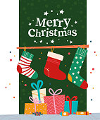 Christmas banner with pile of gift boxes, candy, Christmas stockings and text Merry Christmas greeting on green background. Vector flat illustration. For cards, packaging, web, invitation.