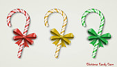 Christmas two realistic Candy Cane with red and green bow isolated on white background. Happy holidays and merry celebrations. Vector illustration EPS10