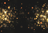 Christmas golden lights. Background of bright glow bokeh.