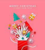 Merry Christmas and Happy New year papercut greeting card. Open holiday gift box with festive paper craft xmas decoration.