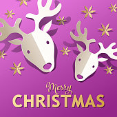 Celebrate Christmas with paper craft of gold colored snowflakes and folded reindeers on the metallic purple colored background