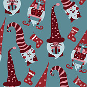 Christmas seamless pattern with red scandinawian gnomes holding gift boxes and xmas stockings on blue background. Hand drawn flat vector illustration.