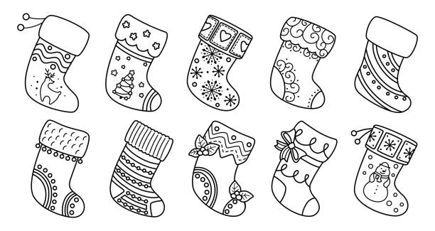 Christmas socks flat line set black linear cartoon Christmas socks flat line set. Black linear cartoon holiday traditional and ornate stockings. Christmas socks for gift, decorated holly and patterns. New Year design collection. Vector illustration christmas stocking stock illustrations