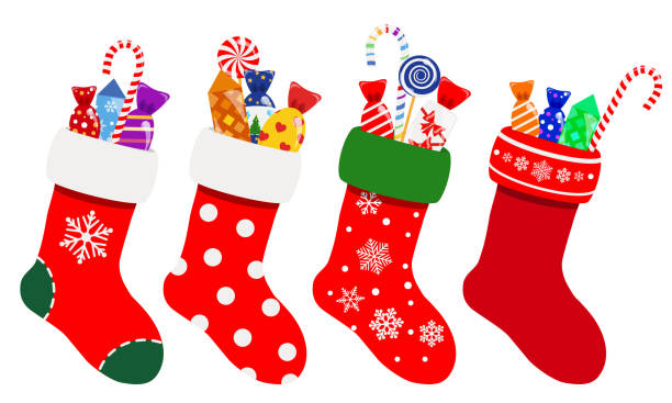 Christmas socks with candies Set of Christmas socks in red colors with candies. Vector illustrations. EPS10 and JPG are available christmas stocking stock illustrations