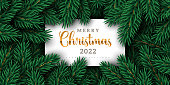 Merry Christmas and Happy New Year 2022 winter background with xmas tree branches and white square frame with place for text. Vector illustration. Holiday flyer, sale voucher or party poster invite