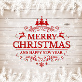 Christmas wooden background with text Merry Christmas and Happy New Year.