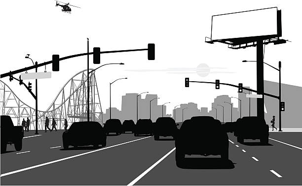 City Arteries A vector silhouette illustration of a busy city street interesction with many cars.  Traffic lights light up, a billboard post no bills, and a helicopter flies in the sky.  A city scape and rollercoaste can be seen in the background. traffic silhouettes stock illustrations